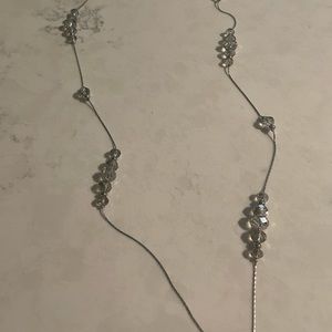 Silver colored necklace with beads